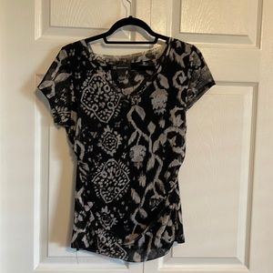 Sheer but not see through top. Can be dressed up or casual.